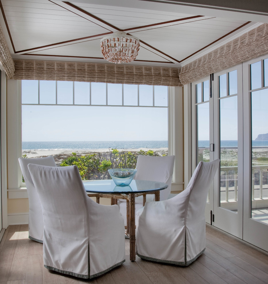 Beach style conservatory in San Diego with medium hardwood flooring and a standard ceiling.