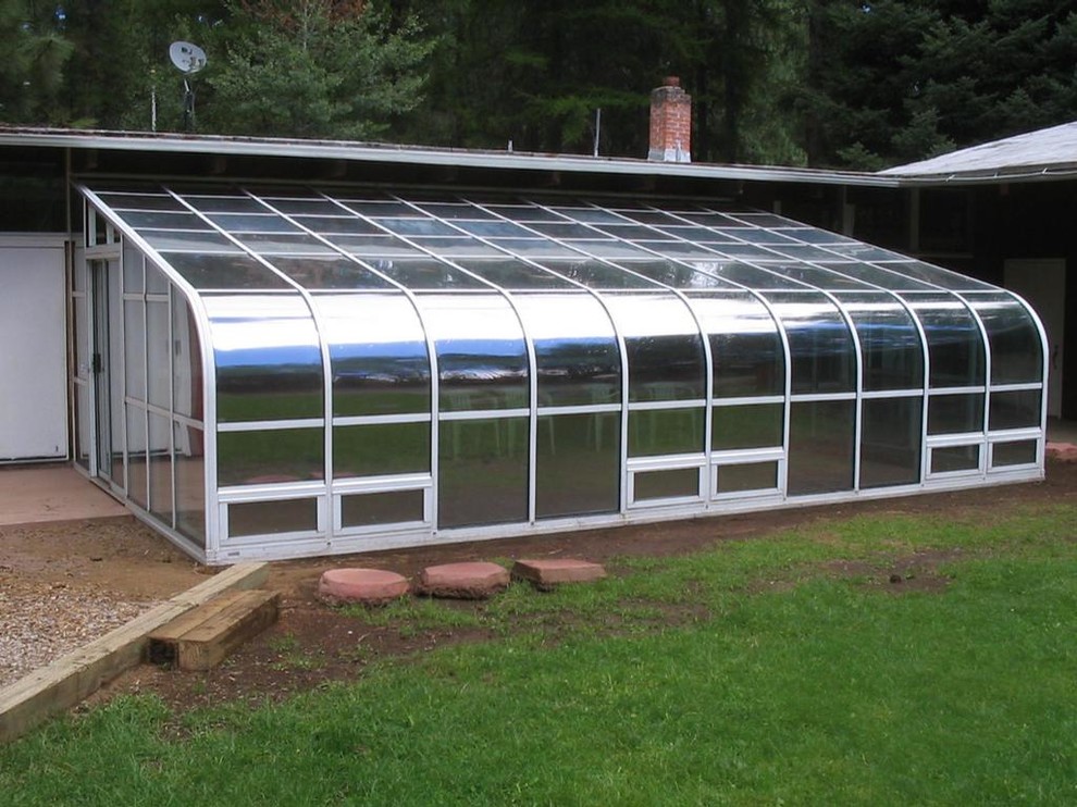 Idee per una grande veranda contemporanea con soffitto in vetro