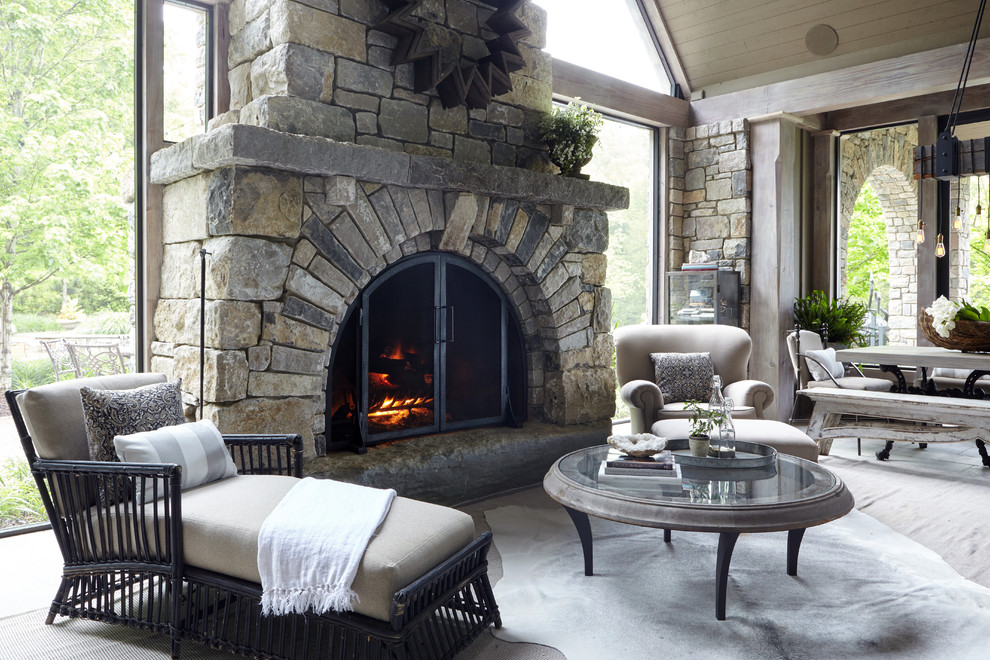 Inspiration for a large traditional conservatory in Nashville with limestone flooring, a standard fireplace, a standard ceiling, grey floors and a stone fireplace surround.