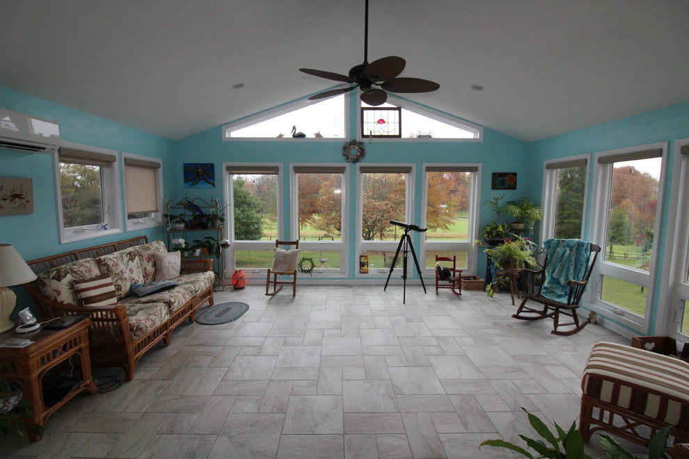 Large island style ceramic tile and gray floor sunroom photo in Other with a standard ceiling
