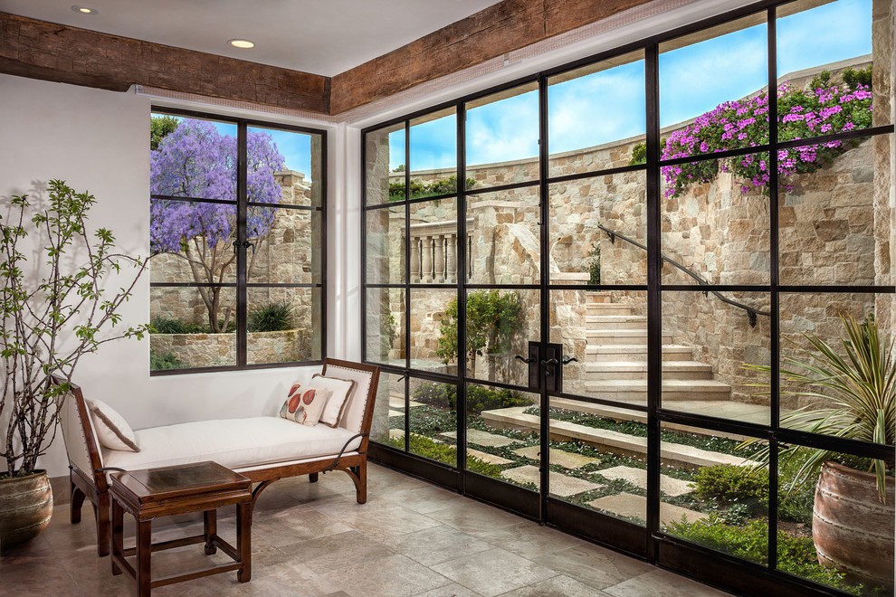 Photo of a medium sized mediterranean conservatory in Orange County with a standard ceiling, ceramic flooring, no fireplace and brown floors.