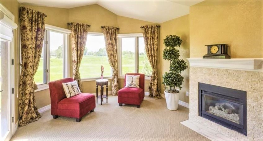 Large rural conservatory in Denver with carpet, a standard fireplace and a standard ceiling.