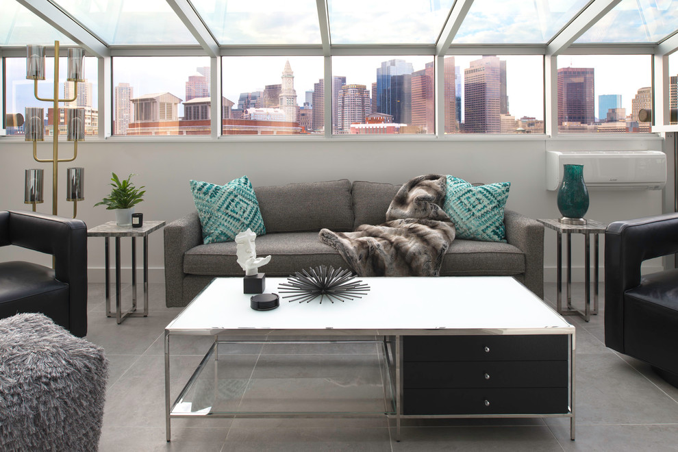 Photo of a small modern conservatory in Boston with concrete flooring, no fireplace, a glass ceiling and grey floors.