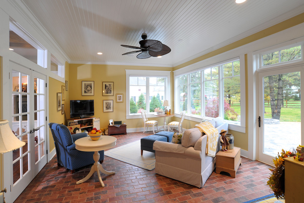 Inspiration for a timeless brick floor and red floor sunroom remodel in Cincinnati with a standard ceiling