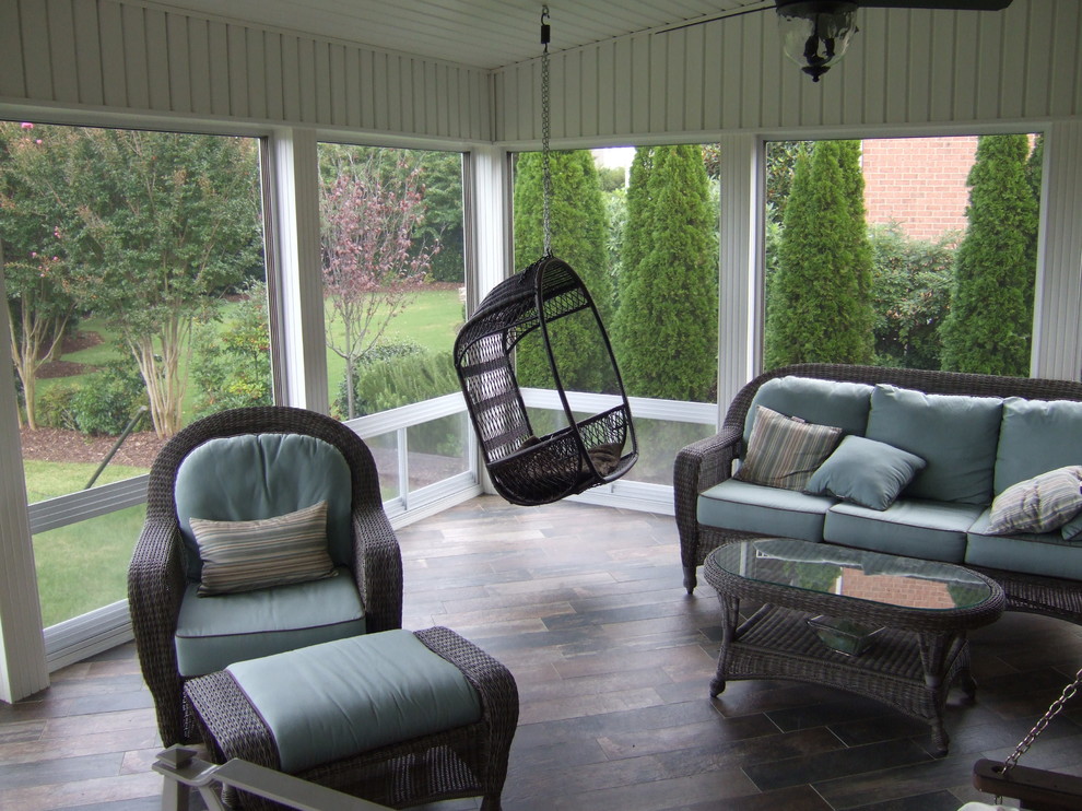 This is an example of a large contemporary conservatory in Other with dark hardwood flooring, no fireplace and a standard ceiling.