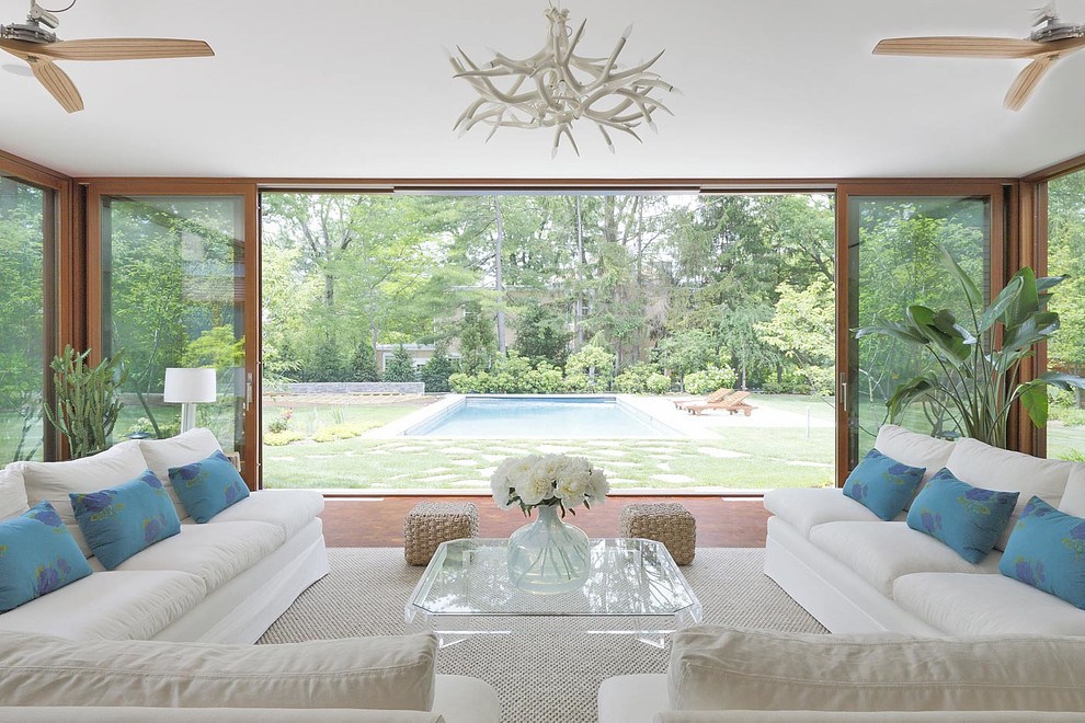 Esempio di una veranda design con soffitto classico