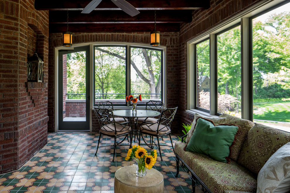 Photo of a large classic conservatory in Minneapolis with ceramic flooring, no fireplace and a standard ceiling.