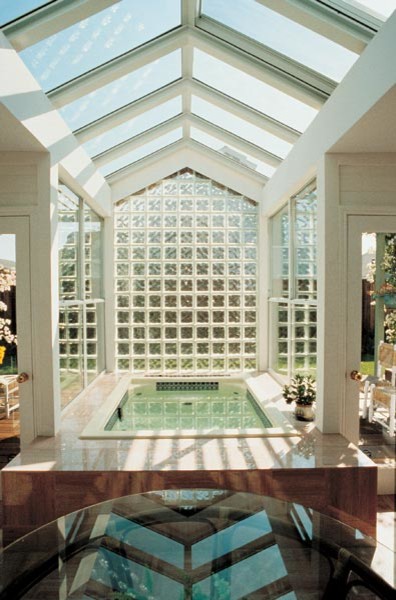 This is an example of a medium sized modern conservatory in Dallas with no fireplace and a glass ceiling.