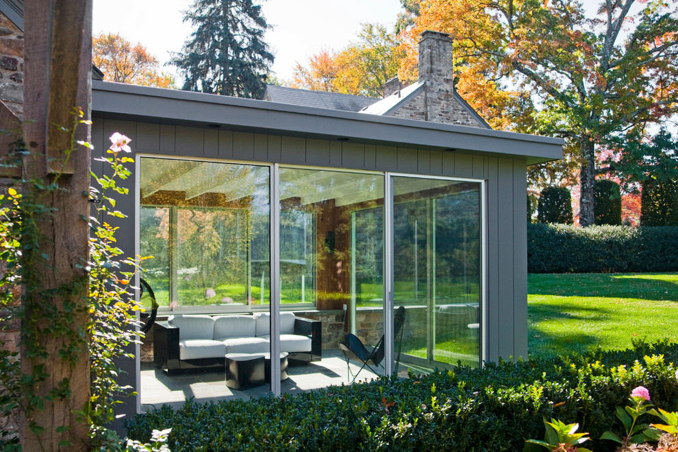 Immagine di una veranda design di medie dimensioni con pavimento in ardesia