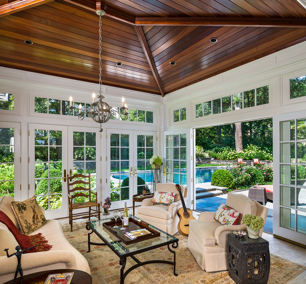 Large classic conservatory in Philadelphia with a standard ceiling, travertine flooring, no fireplace and beige floors.