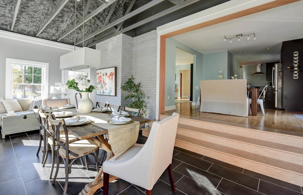Immagine di una grande veranda minimal con pavimento in gres porcellanato, nessun camino, soffitto classico e pavimento grigio