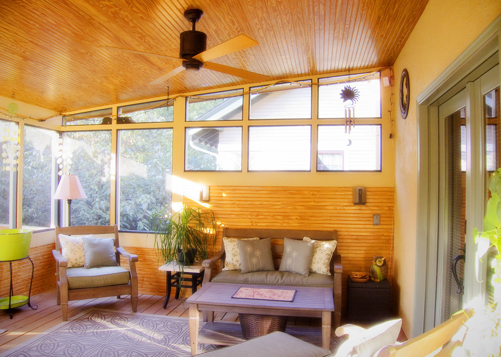 Example of a mid-sized tuscan medium tone wood floor sunroom design in Louisville with no fireplace and a standard ceiling