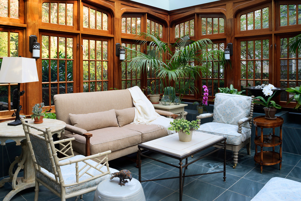 This is an example of a traditional conservatory in DC Metro with slate flooring and grey floors.