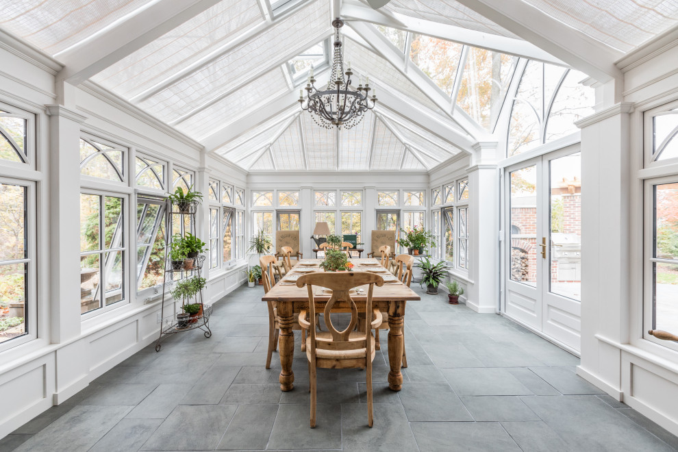 Large classic conservatory in Indianapolis with travertine flooring and a glass ceiling.