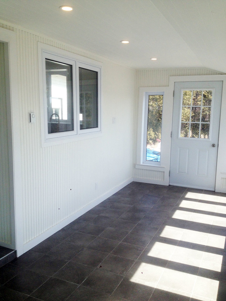 Photo of a medium sized rural conservatory in Ottawa with porcelain flooring, no fireplace and a standard ceiling.