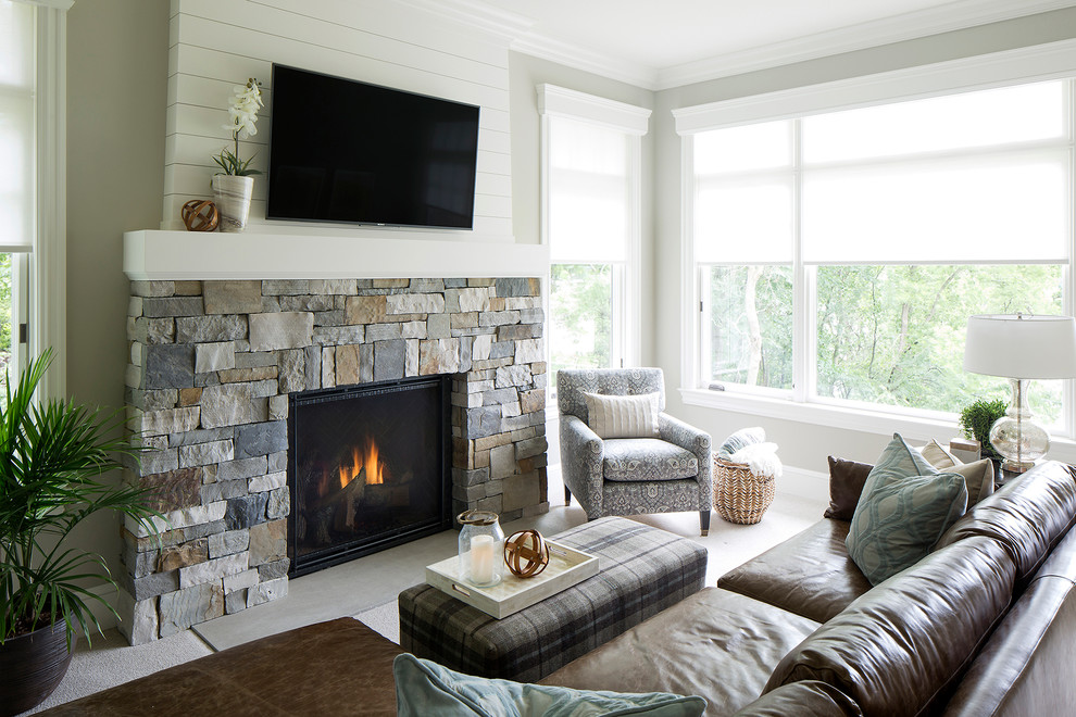 Inspiration for a mid-sized carpeted sunroom remodel in Minneapolis with a standard fireplace and a stone fireplace
