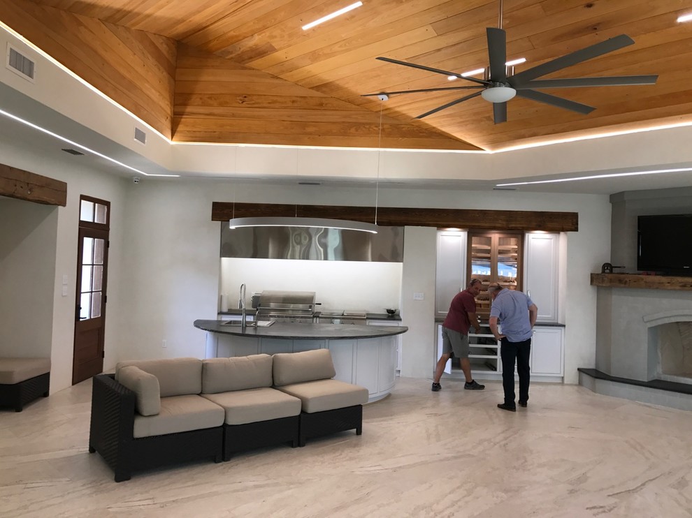 Example of a huge transitional travertine floor sunroom design in New Orleans with a standard ceiling