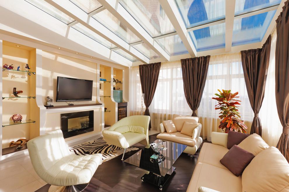 Medium sized modern conservatory in Denver with dark hardwood flooring, a standard fireplace, a plastered fireplace surround, a glass ceiling and brown floors.