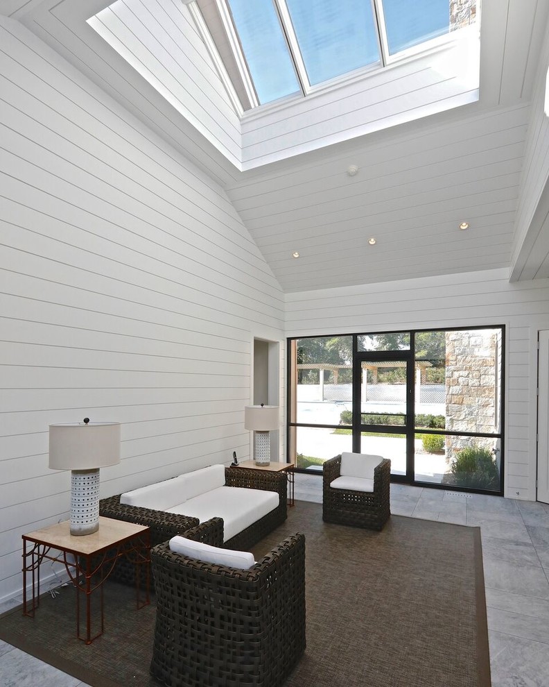 Inspiration for a large contemporary marble floor and blue floor sunroom remodel in New York with a skylight