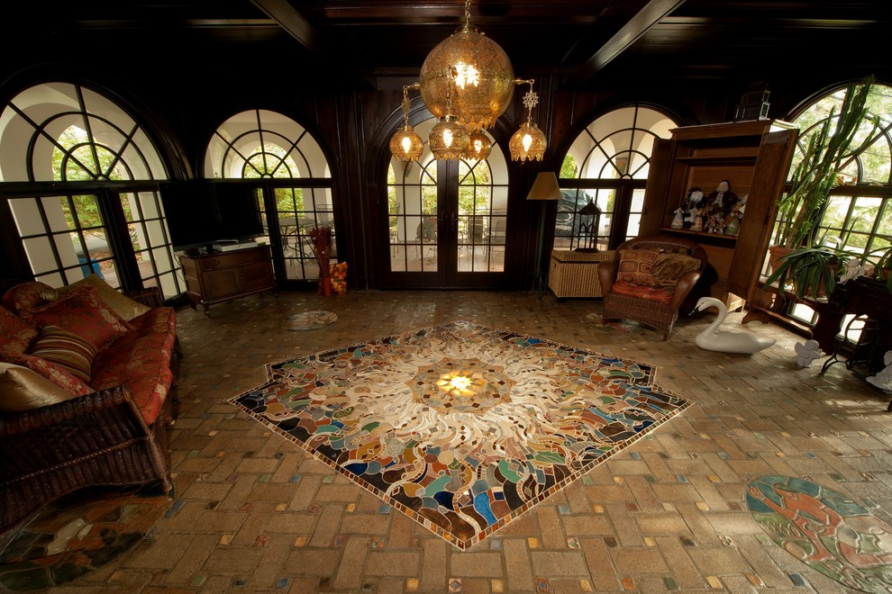 This is an example of a large traditional conservatory in Philadelphia with no fireplace and a standard ceiling.