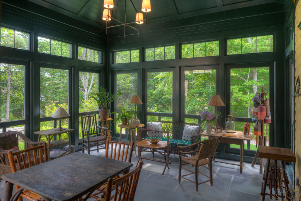 Large transitional concrete floor sunroom photo in New York with a standard ceiling