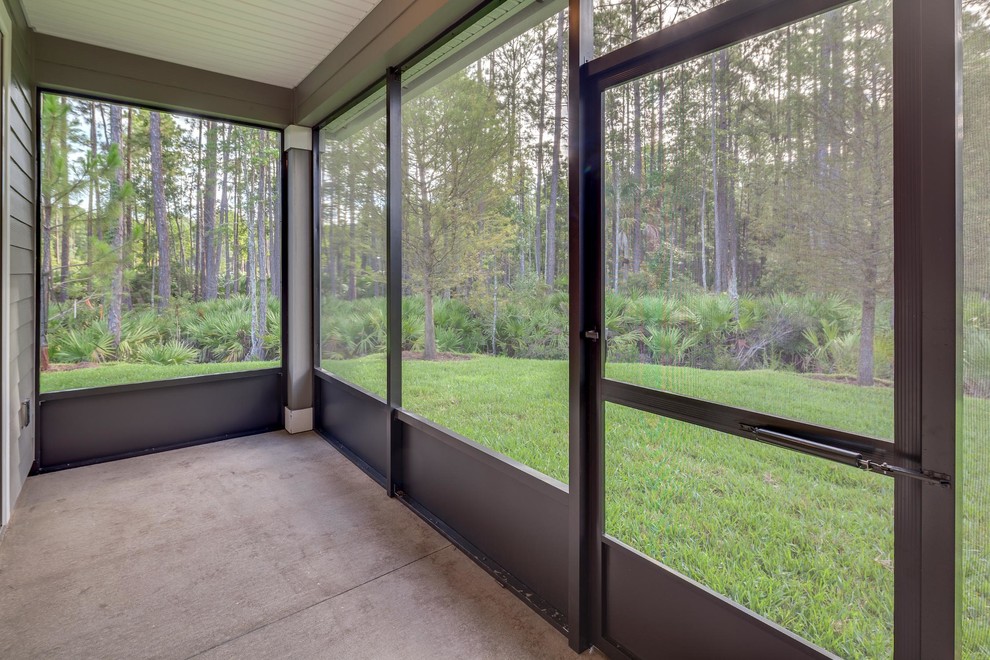 Inspiration for a small timeless concrete floor sunroom remodel in Jacksonville with no fireplace and a standard ceiling