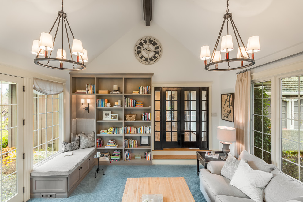 Esempio di una veranda classica di medie dimensioni con moquette, camino classico, soffitto classico e pavimento blu