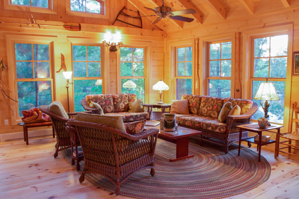 Inspiration for a large rustic conservatory in Other with light hardwood flooring.