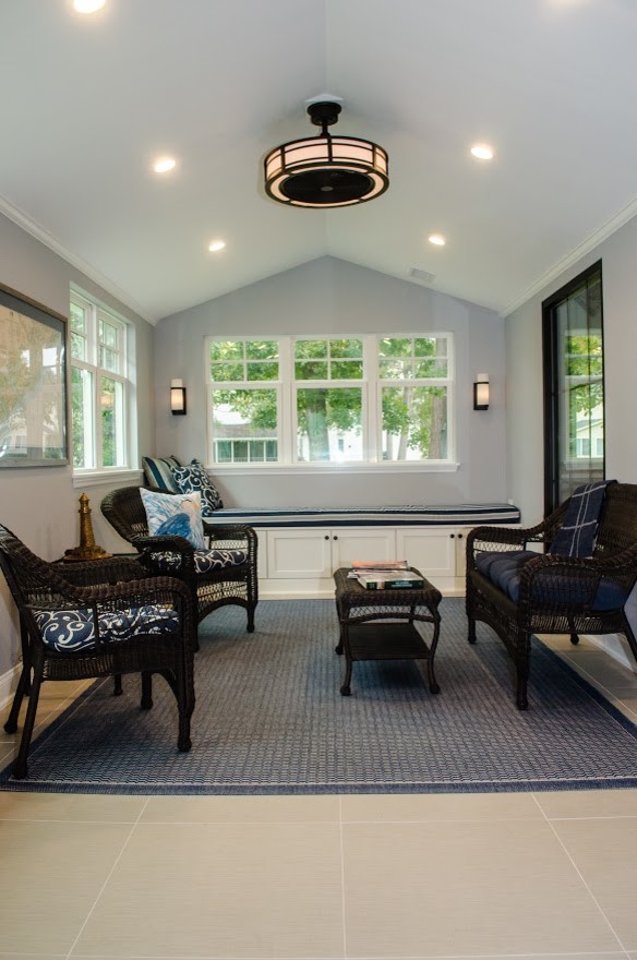 Immagine di una veranda country di medie dimensioni con pavimento in gres porcellanato, soffitto classico e pavimento beige