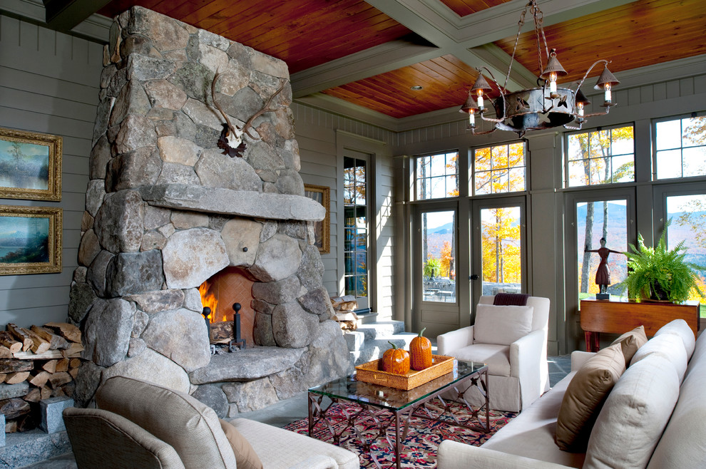 Large elegant slate floor sunroom photo in Boston with a two-sided fireplace, a stone fireplace and a standard ceiling