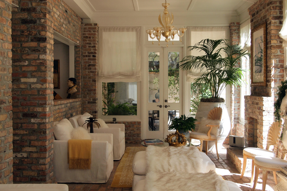 Design ideas for a small traditional conservatory in New Orleans with brick flooring, a standard fireplace, a brick fireplace surround and a standard ceiling.
