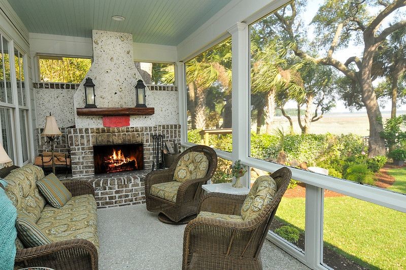 Example of a mid-sized mountain style concrete floor sunroom design in Atlanta with a standard fireplace and a brick fireplace