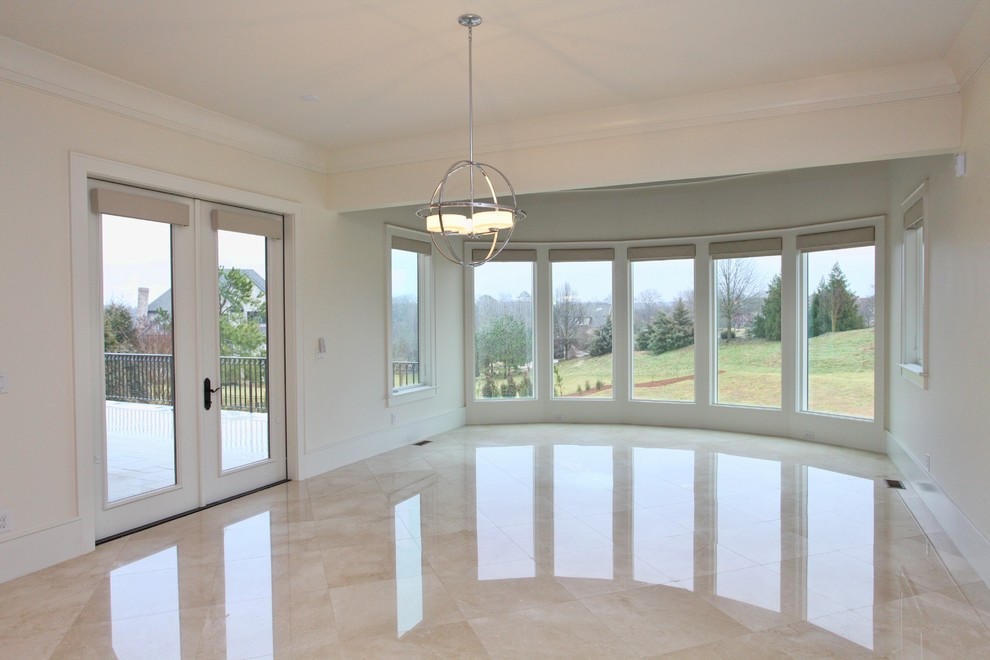 Expansive modern conservatory in Raleigh with marble flooring, a standard ceiling and beige floors.