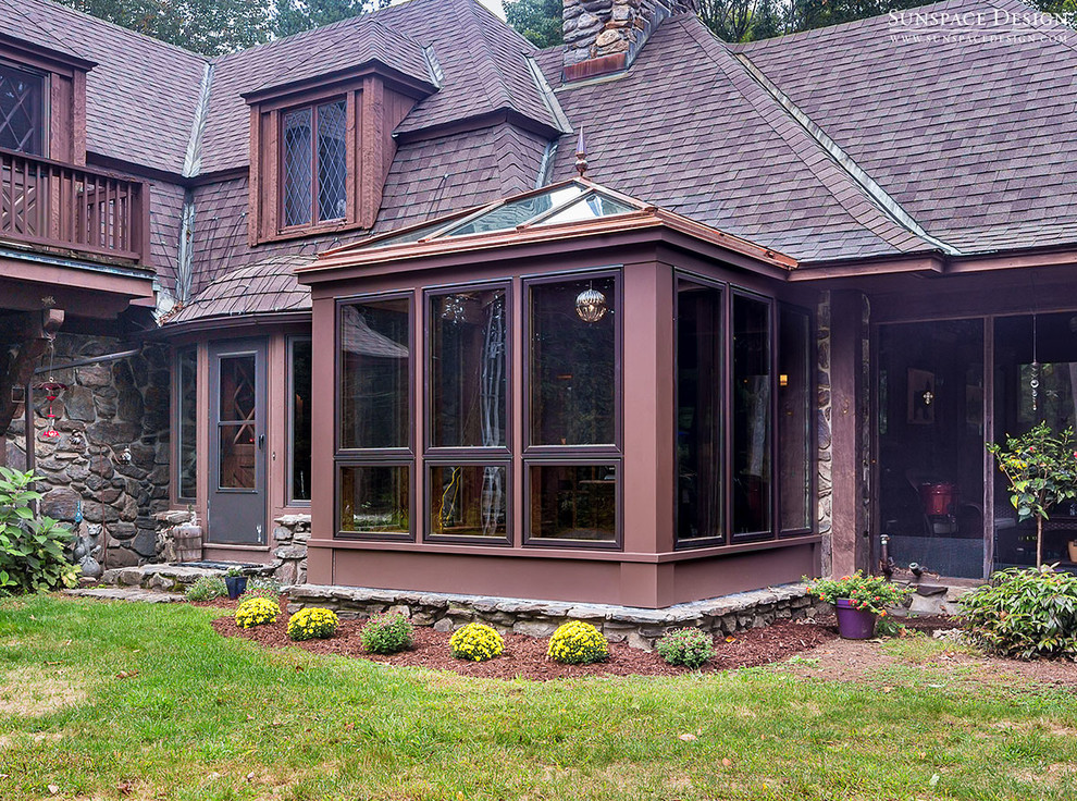 Photo of a small classic conservatory in Boston with dark hardwood flooring, no fireplace and a glass ceiling.