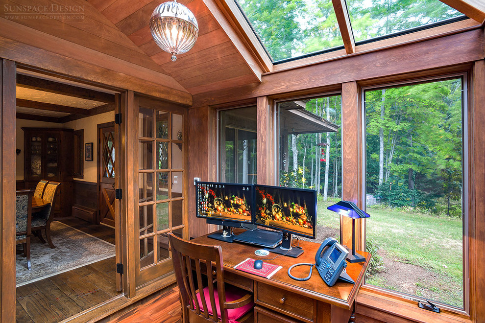 Photo of a small traditional conservatory in Boston with dark hardwood flooring, no fireplace and a glass ceiling.