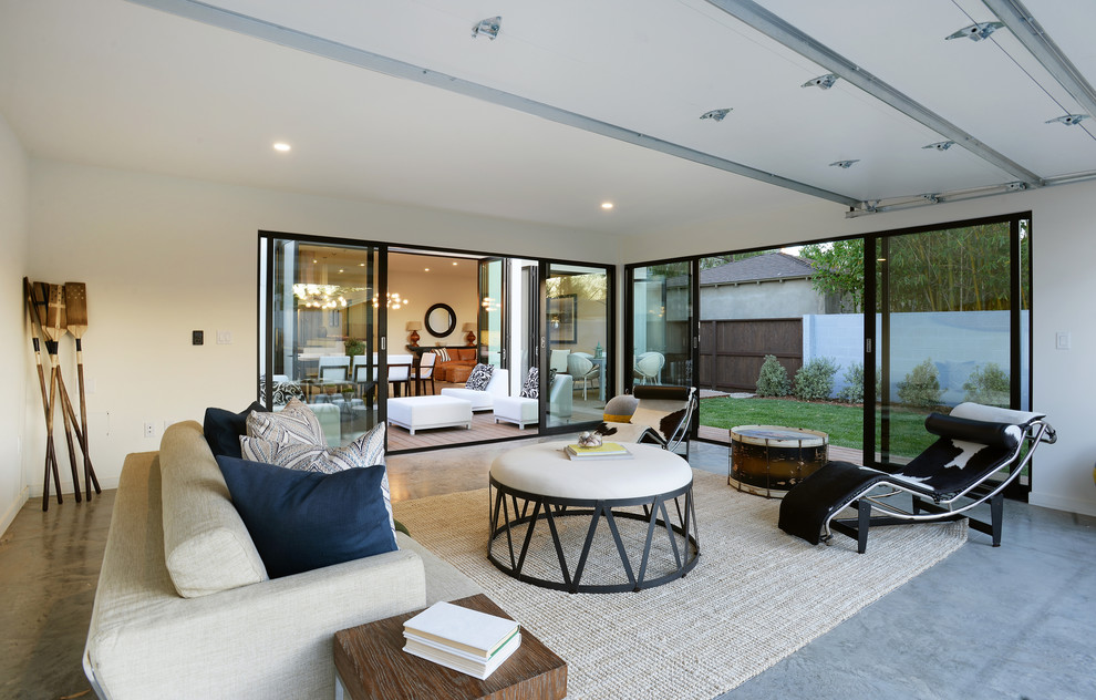 This is an example of a contemporary conservatory in Los Angeles with concrete flooring and a standard ceiling.