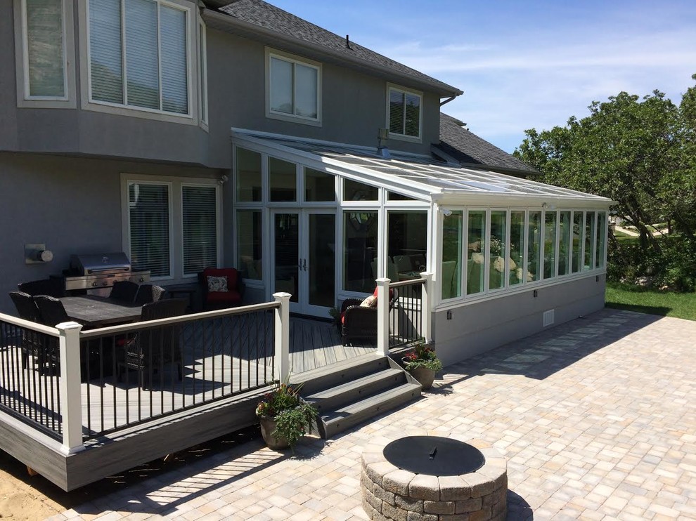 Example of a large trendy sunroom design in Chicago with a glass ceiling