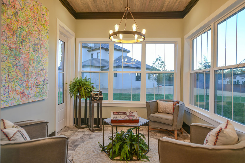 This is an example of a medium sized contemporary conservatory in Orlando with no fireplace, a standard ceiling and brown floors.