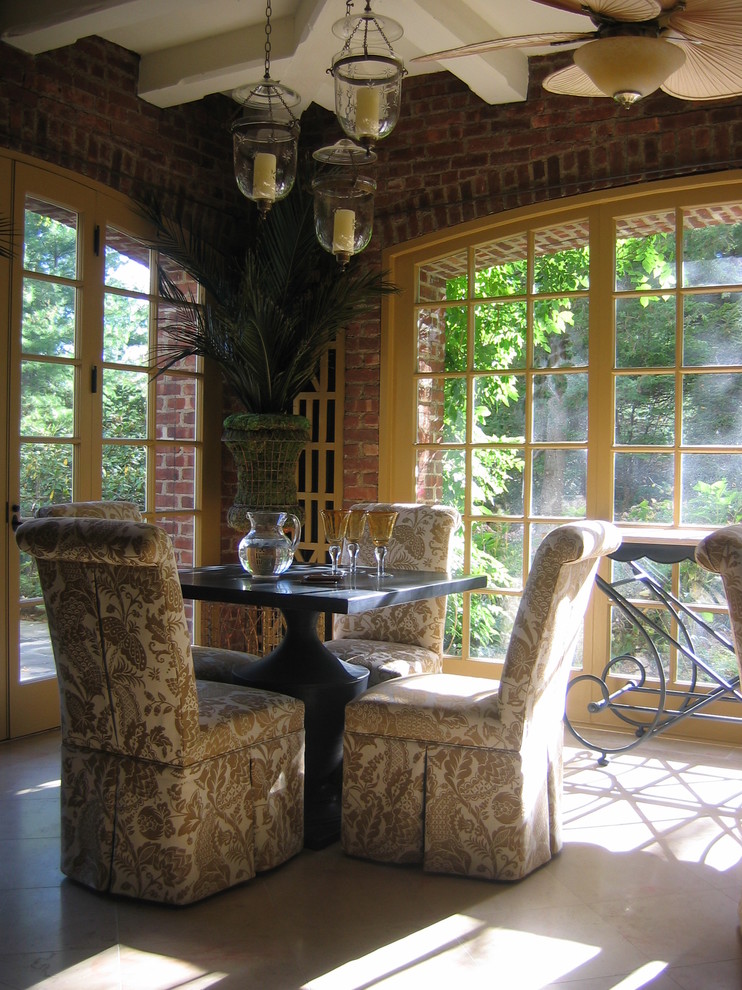 This is an example of a medium sized traditional conservatory in New York with limestone flooring and white floors.
