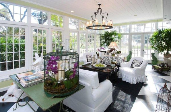 This is an example of a large world-inspired conservatory in Miami with ceramic flooring, no fireplace, a standard ceiling and multi-coloured floors.