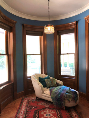 Example of a huge ornate light wood floor and brown floor sunroom design in St Louis with a standard ceiling