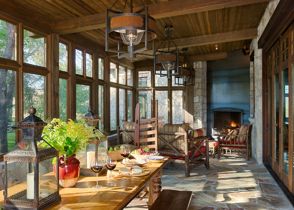 Design ideas for a large rustic conservatory in Vancouver with slate flooring, a corner fireplace, a metal fireplace surround and a standard ceiling.