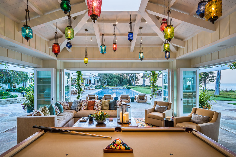 This is an example of a beach style conservatory in Santa Barbara with no fireplace and a skylight.