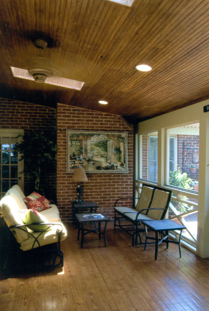 Photo of a large traditional conservatory in Charlotte with medium hardwood flooring, no fireplace and a standard ceiling.