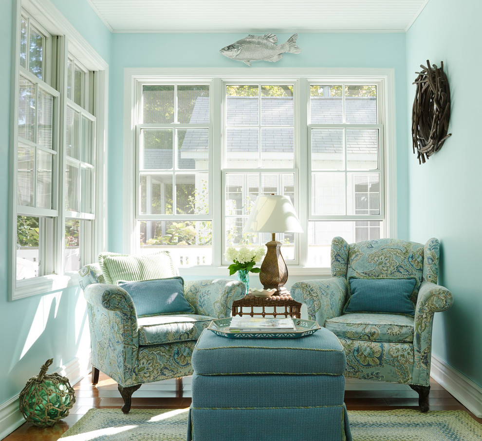 Inspiration for a coastal medium tone wood floor sunroom remodel in Chicago with a standard ceiling