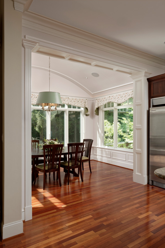 Photo of a classic conservatory in DC Metro with medium hardwood flooring and brown floors.