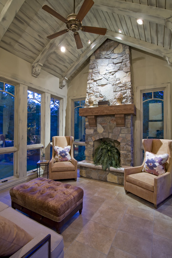 Photo of a rustic conservatory in Minneapolis with a stone fireplace surround and a standard ceiling.