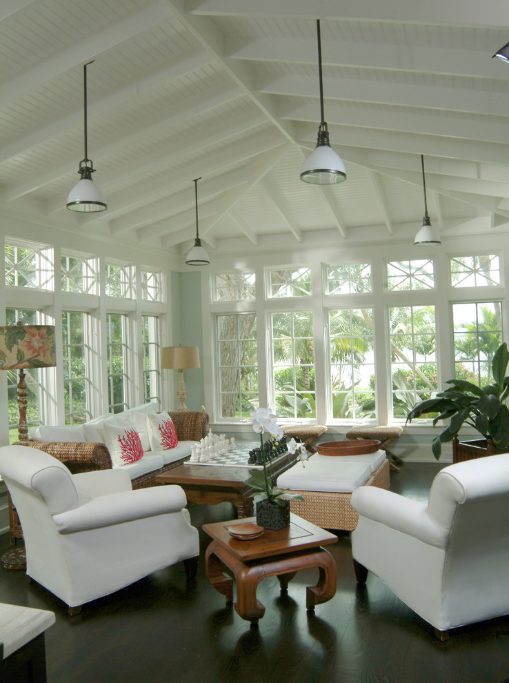Inspiration for a tropical dark wood floor and black floor sunroom remodel in Miami with a standard ceiling