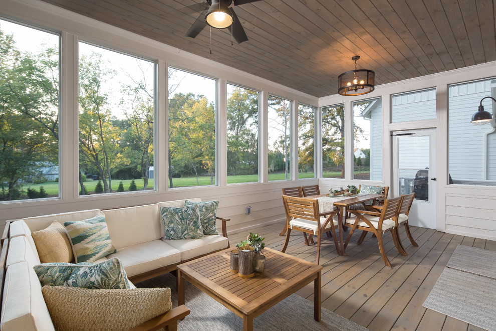 Inspiration for a country conservatory in Atlanta with medium hardwood flooring, a standard ceiling and brown floors.