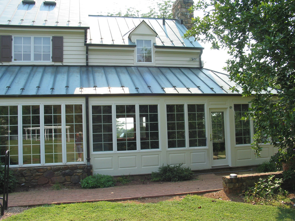 Design ideas for a medium sized farmhouse conservatory in DC Metro with no fireplace and a standard ceiling.